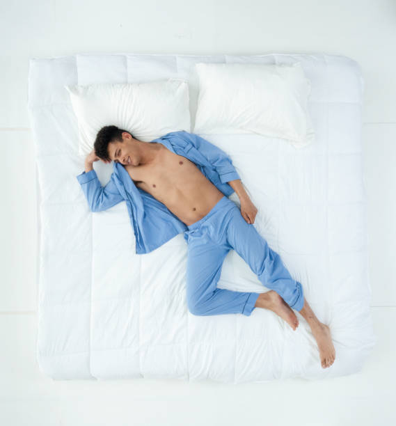 istock Sexy African American man on bed 1161091688