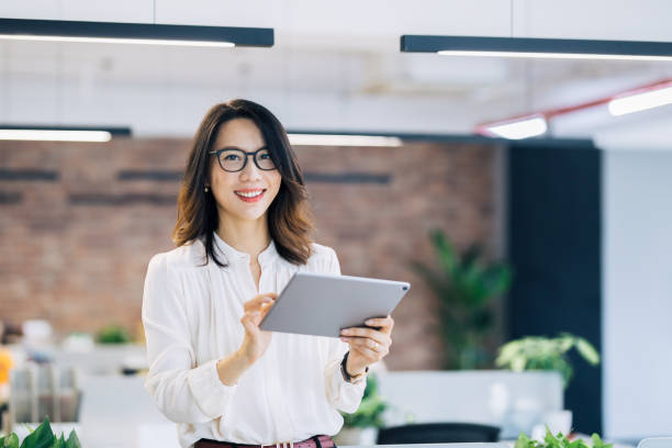 istock Professional Asian businesswoman using digital tablet 1161093508