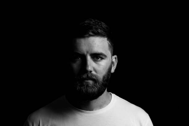 istock Low key portrait of young bearded man 1161094393