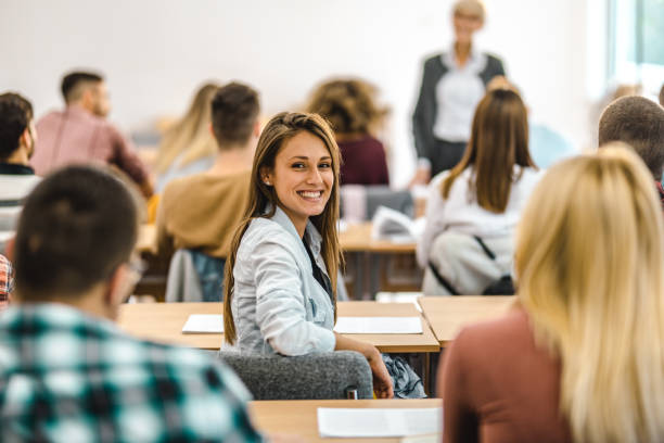 istock Happy female student on a class at amphitheater. 1161094490