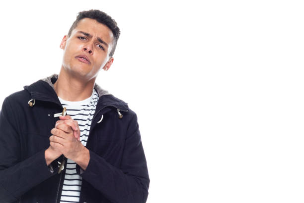 Handsome black man with curly hair and wearing a jacket - pleading