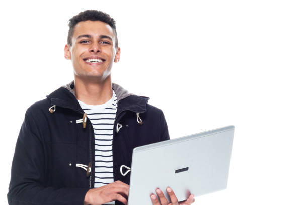 istock Handsome tall black man wearing a jacket on white background - holding laptop 1161099489