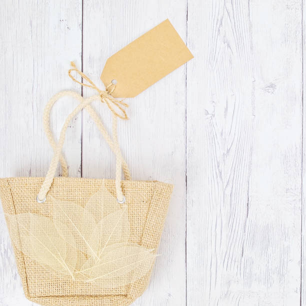 A horizontal image of a burlap sack of coal.