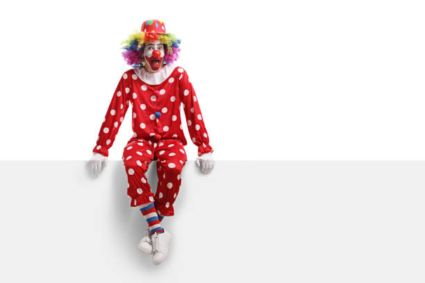 istock Surprised clown sitting on a white billboard 1161113127