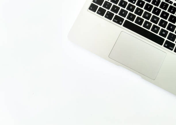 istock Top view flat layout of laptop with English keyboard with space at for copywrite text on white background 1161117129