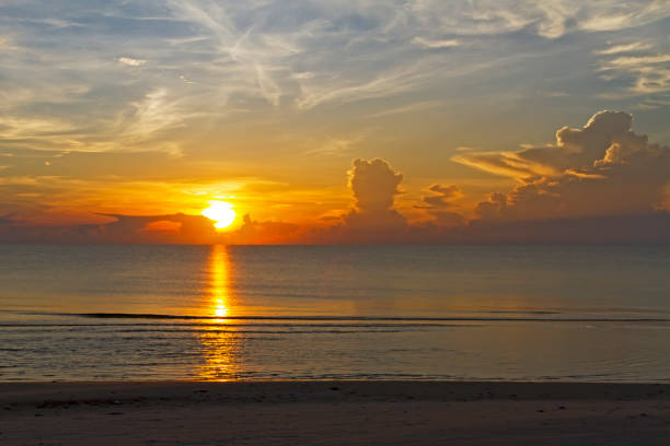 istock Sunrise on sea with silhouette on beach at beach 1161117172