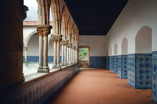 Ancient monastery cloister in portugal with the traditional painted tiles (azulejos) decorating the walls