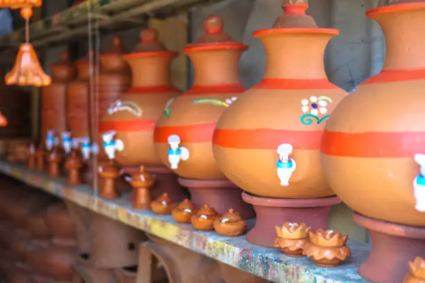 Ceramic pots on the Eastern market in Asia in which they make food or grow plants. Stock photo