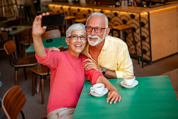 istock Happy senior couple taking selfie on mobile phone 1161124732
