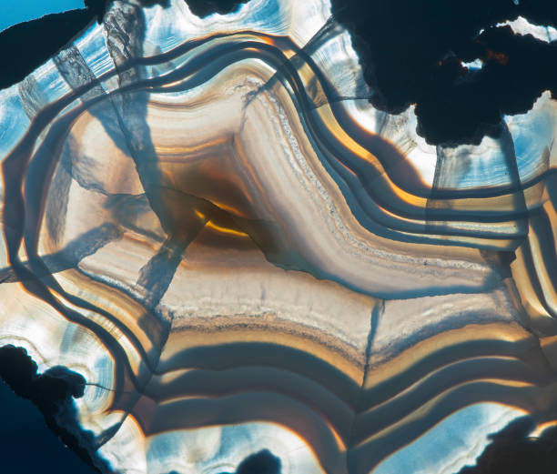 istock Translucent blue  slice of natural stone agate. Natural concentric patterns and textures of minerals for background. 1161126758