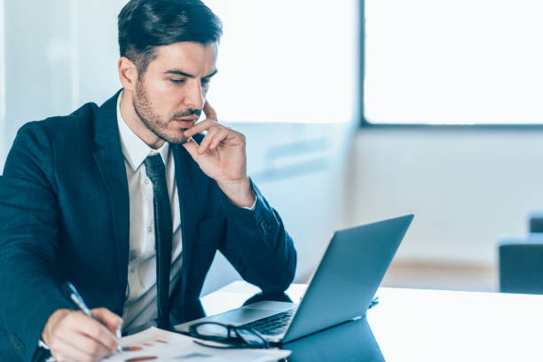 istock Young businessman working in office 1161128746