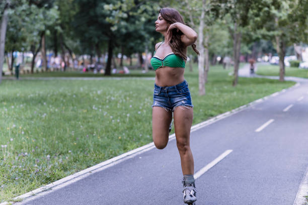 istock Woman is Having a Fun in Park on Roller Skates 1161134747