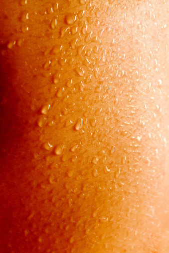 close up of water drops (sweat) on the human skin. suitable for background