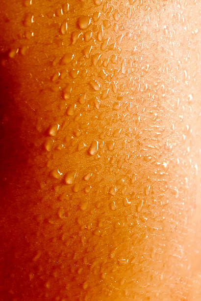 drops close up of water drops (sweat) on the human skin. suitable for background sweat droplet stock pictures, royalty-free photos & images