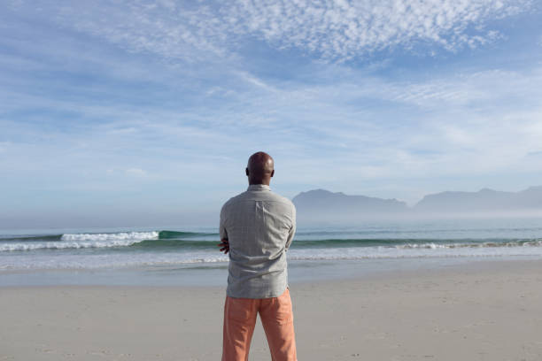 istock Man with gazing at the beach. 1161138350