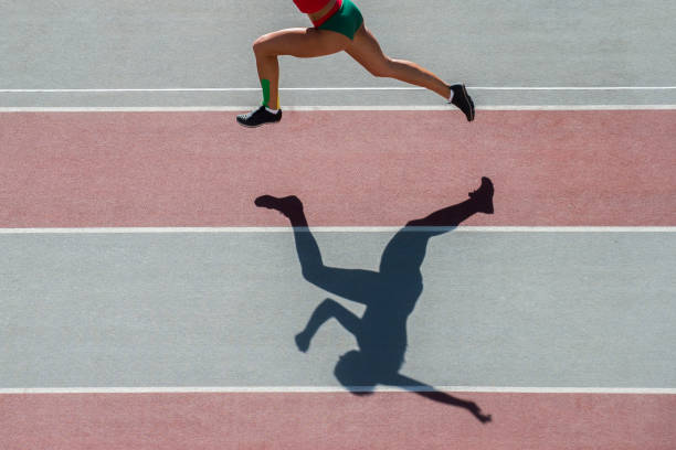 istock Low Section Of Woman Running On Track 1161143617