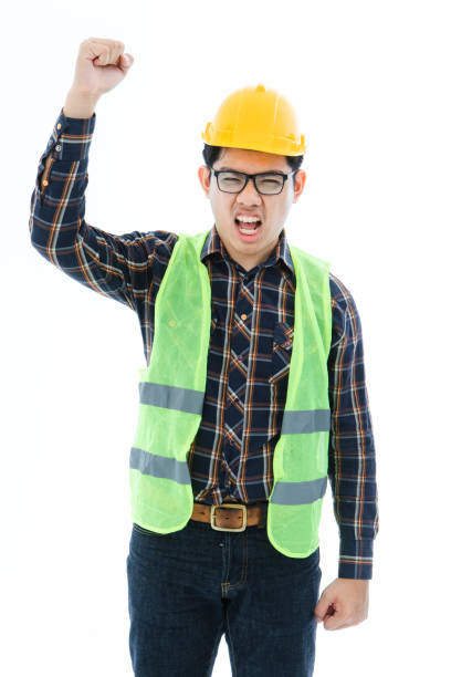 istock Engineer man cross arm orange helmet and vest 1161145280