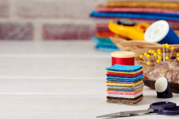 stack of square pieces of colorful fabrics, accessories for quilting - patch textile stack heap imagens e fotografias de stock