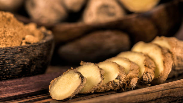 istock Sliced Ginger Root and Ginger Powder in the Bowl 1161147005