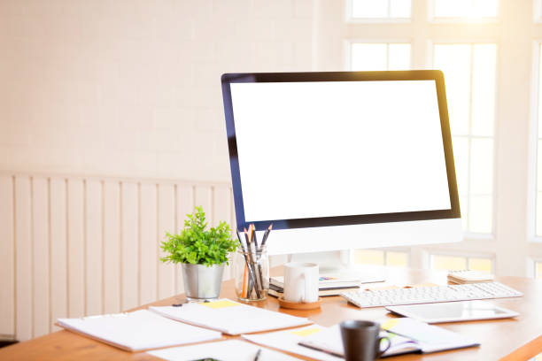 istock Office desks in the office and computer white screen with office equipment 1161147938