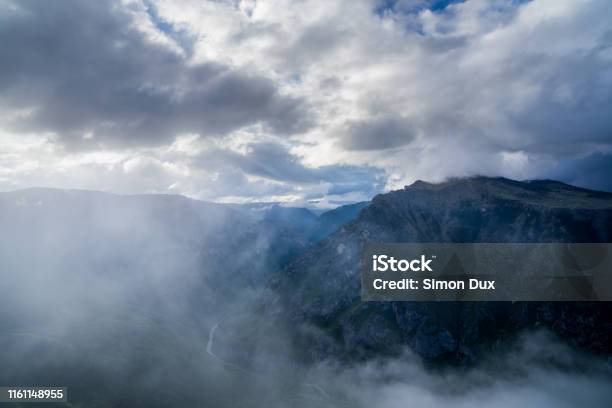 Montenegro Above Spectacular Tara River Canyon Nature Landscape Of Durmitor National Park Near Zabljak From Peak Of Mount Curevac In Foggy Dawning Atmosphere Stock Photo - Download Image Now
