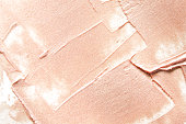 Beige smears of crushed highlighter or luminizer. - Image