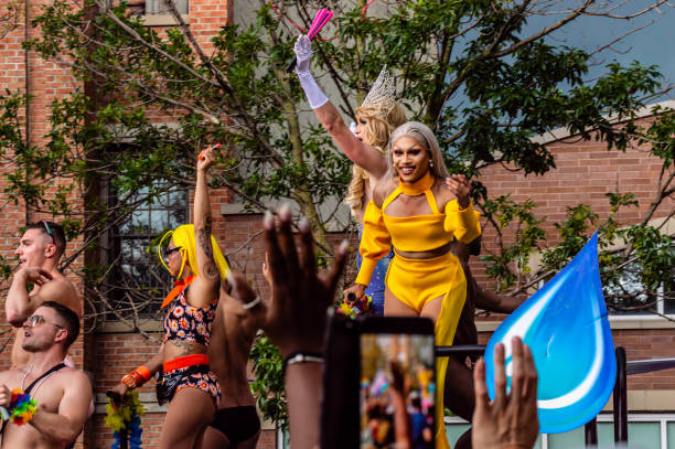 Crowds cheer for the Drag Queen performers at the Gay Pride parade. Lakeview, Chicago-June 30, 2019: Crowds cheer for the Drag Queen performers at the Gay Pride parade.  drag show stock pictures, royalty-free photos & images