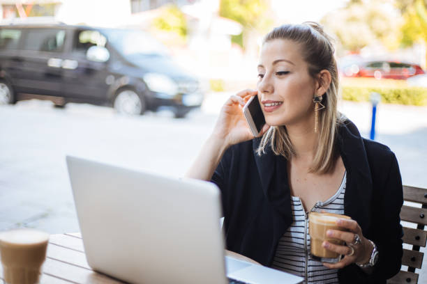 istock Woman using smartphone and laptop 1161151514