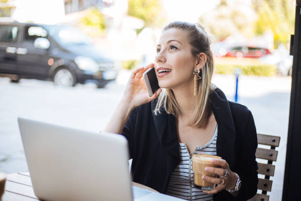 istock Woman using smartphone and laptop 1161151518