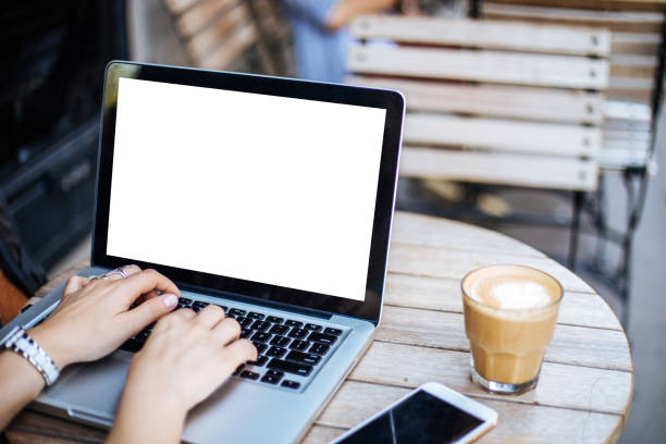 istock Cropped image of woman using laptop with blank screen 1161151652