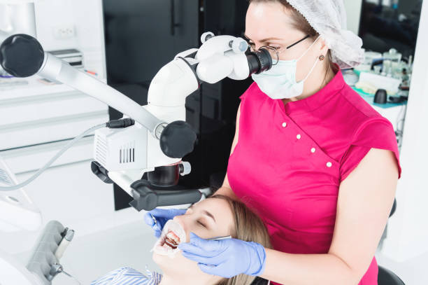 istock A female professional dentist examines a female patient with a stamotologic microscope in her office 1161153265