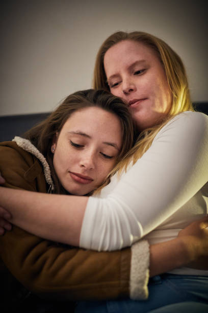 istock young woman consoles her unhappy girlfriend, hugging her 1161153312