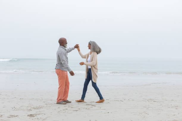 istock Couple dancing at the beach 1161154174