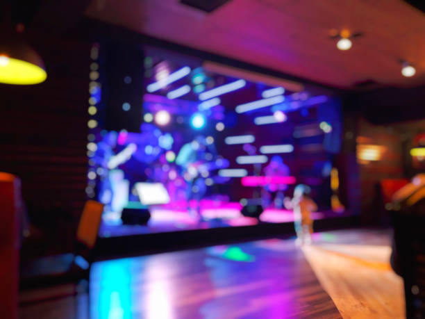 istock Scene with light, musicians on stage in the rock-cafe. Blur effect 1161154206