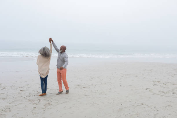 istock Couple dancing at the beach 1161154258