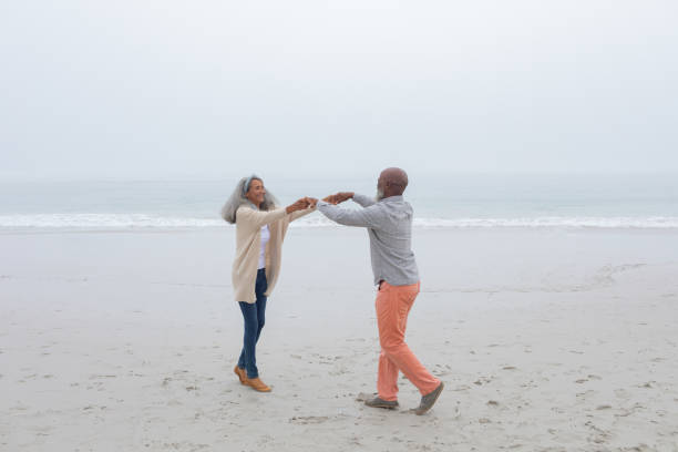 istock Couple dancing at the beach 1161154303