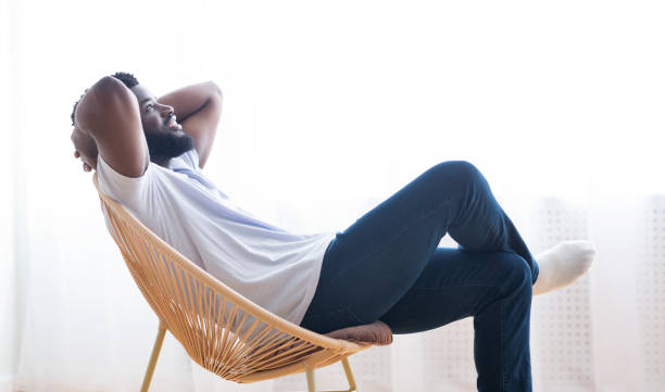 istock Millennial african american guy relaxing at home 1161154633