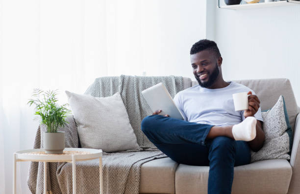 istock African american man watching movie on tablet 1161154713