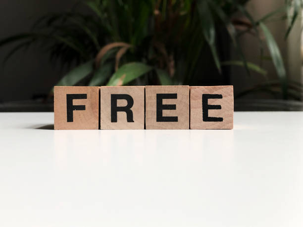 istock Free written with wood cubes on a white table 1161154757