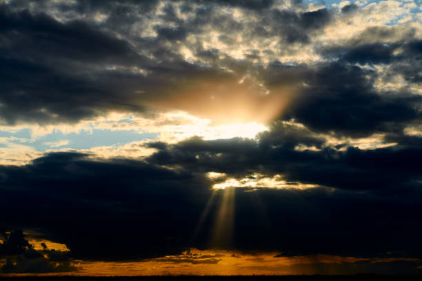 istock Beautiful sunset - dark sky with clouds and sunlight 1161157483