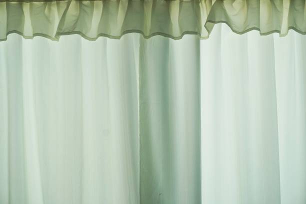 istock green curtain or drapery background 1161157914