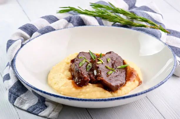 Photo of Pork Cheeks In Demiglas Sauce with mashed potatoes. Carrillada de cerdo in demi glace sauce