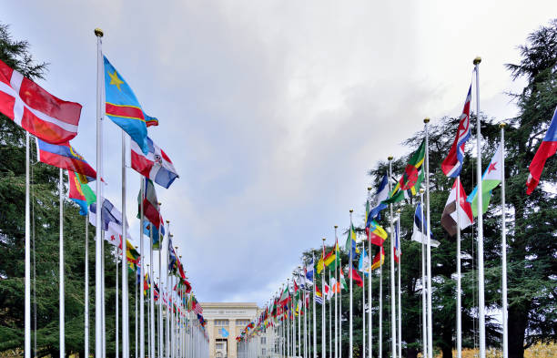 Geneva, Switzerland - Aug 16, 2020: blue skyscraper of WIPO, the World Intellectual Property Organization of the United Nations, located in Geneva city. UN flag on the top of skyscraper.