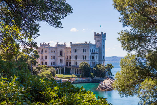 Miramare Castle Trieste, Italy - July 16, 2017: View of Miramare Castle, a 19th Century Castle, on the Gulf of Trieste. trieste stock pictures, royalty-free photos & images