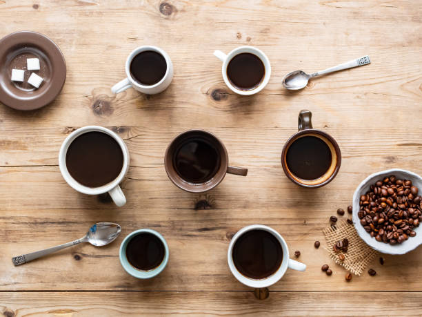 istock Coffee cups and a cup with roasted coffee beans 1161162382