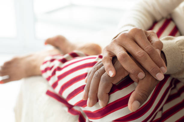 istock Couple hands resting on top of each other 1161162397