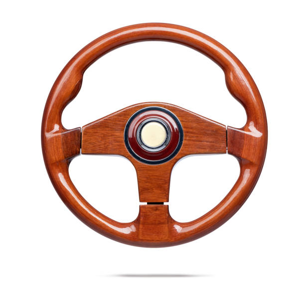 Old wooden steering wheel isolated on withe background. File contains a path to isolation