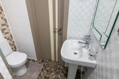 The interior of a small toilet in the hotel room