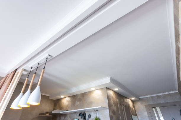 Zoned suspended plastered ceiling in the kitchen stock photo