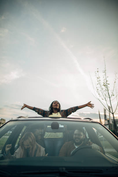 istock Black woman enjoying in car ride 1161163322